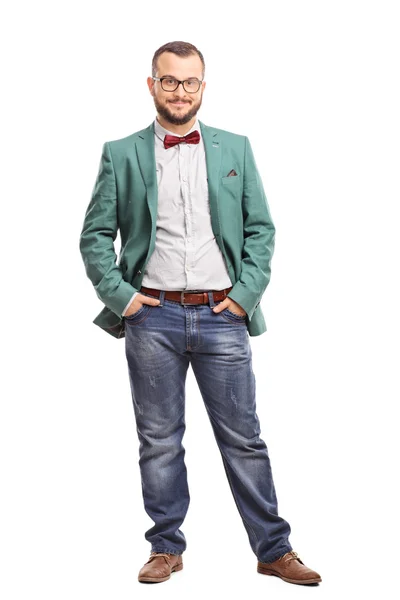 Young man posing in a green coat — Stockfoto