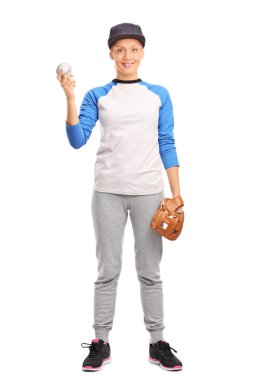 Young blond woman holding a baseball