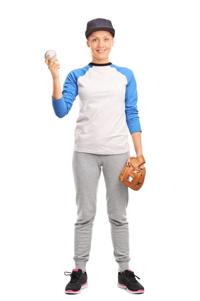 Young blond woman holding a baseball — 스톡 사진