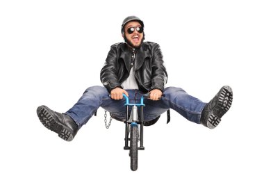 Young biker riding a small bicycle clipart