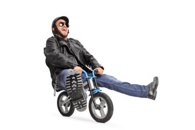 young biker riding a small bicycle
