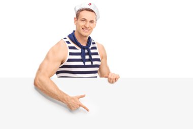 Young sailor pointing on a blank signboard clipart