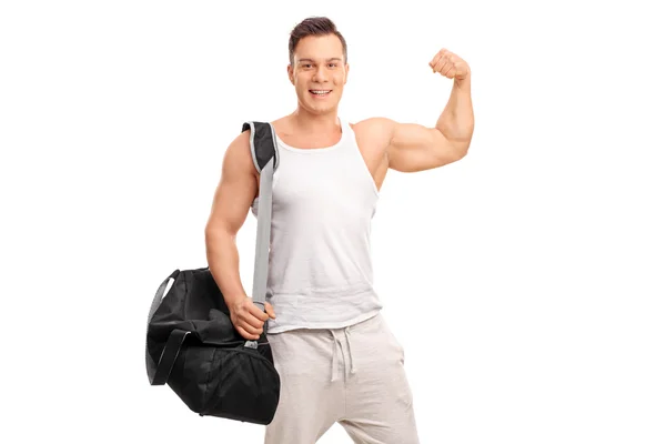 Muscular man showing his bicep — Stock Photo, Image