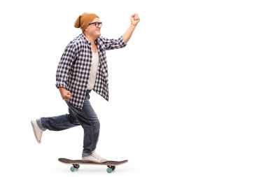 Joyful senior skater riding a skateboard