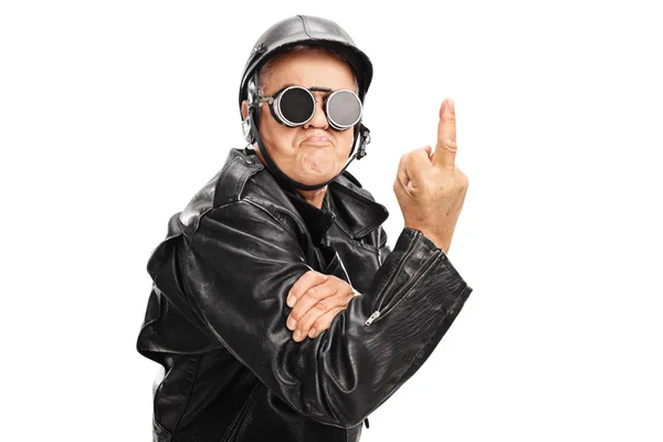 Senior biker showing a middle finger — Stok fotoğraf