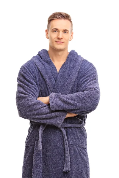 Young man in a blue bathrobe smiling — Stok fotoğraf