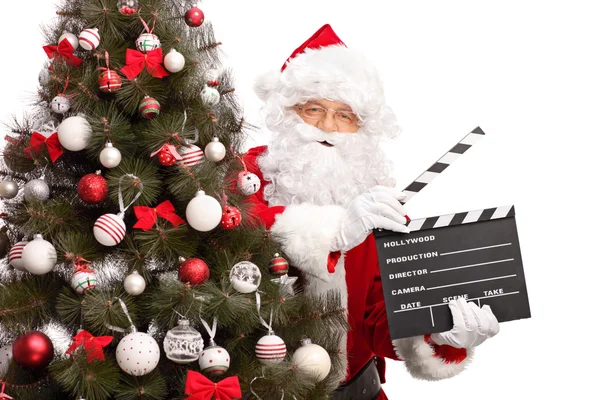 Santa Claus holding a movie clapperboard — Stock Photo, Image