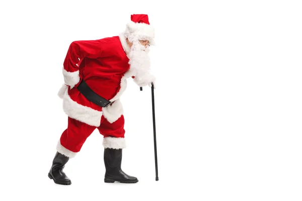 Santa Claus lopen met een stok — Stockfoto
