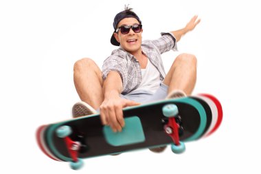 Skater performing tricks with his skateboard clipart