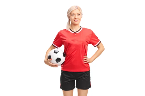 Female football player holding a ball — Stock Photo, Image