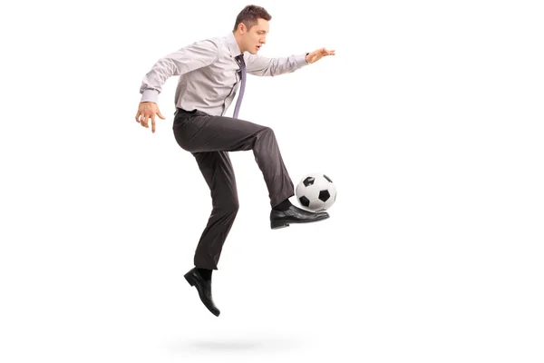 Young businessman playing football — Stock Photo, Image