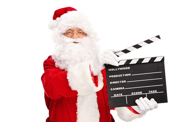 Weihnachtsmann in der Hand eines Filmklappbretts — Stockfoto