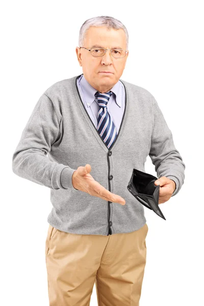 Mature man holding an empty wallet — Stock Photo, Image