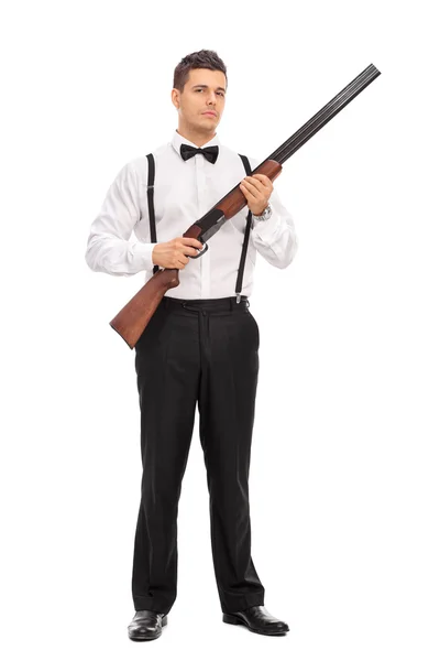 Mladý muž s puškou brokovnice — Stock fotografie