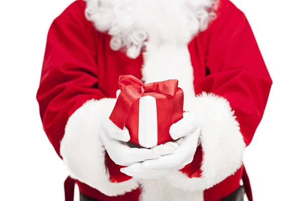 Santa Claus holding a present Royalty Free Stock Photos