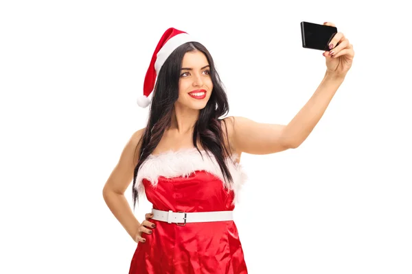 Woman in Santa outfit taking a selfie — Stock Photo, Image