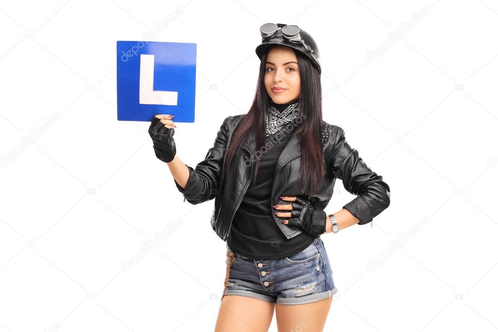 female biker holding an L-sign