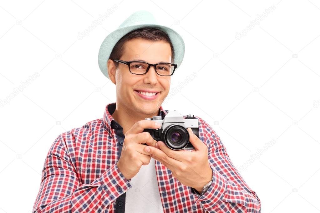 Male photographer holding a camera 