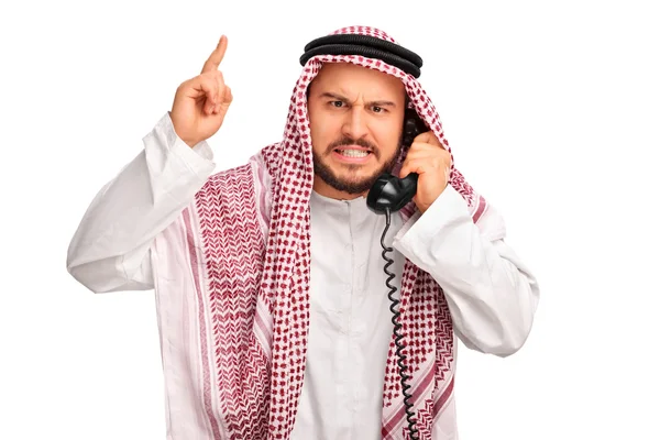 Árabe irritado falando por telefone — Fotografia de Stock