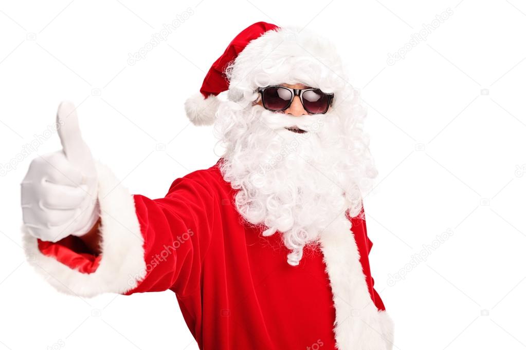 Santa with sunglasses giving a thumb up