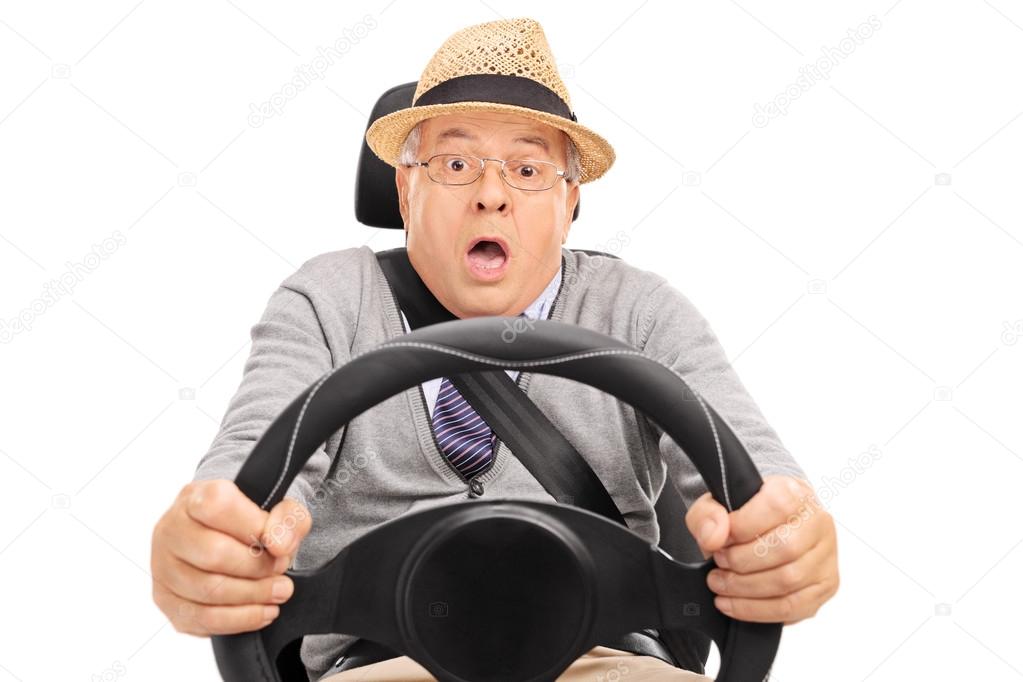 senior man driving and pressing the brake