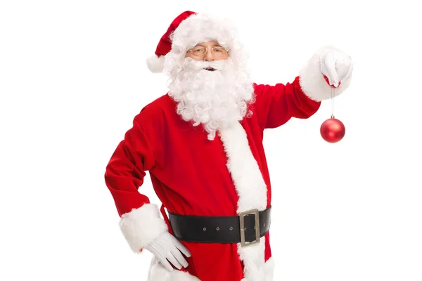 Papai Noel segurando bola de Natal — Fotografia de Stock