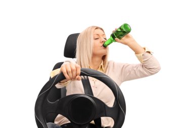Irresponsible woman drinking and driving  clipart