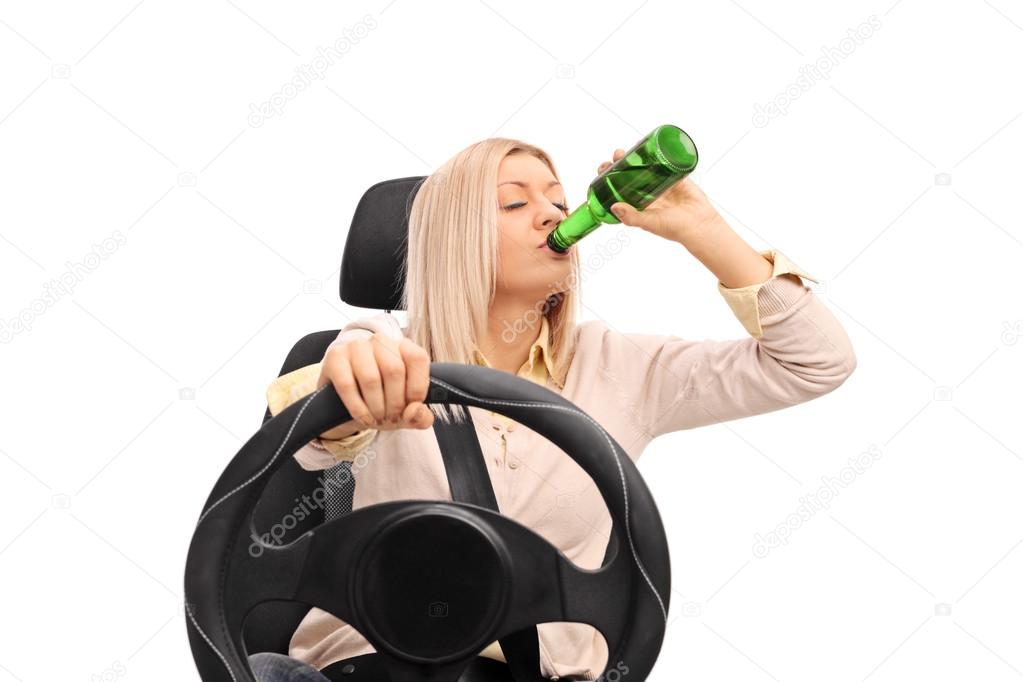Irresponsible woman drinking and driving 