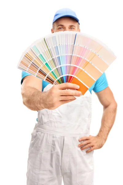 Young painter spreading a color swatch — Stock Photo, Image