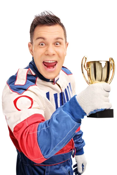 Delighted car racer holding a trophy — Stok fotoğraf