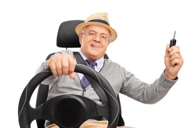 senior gentleman holding a car key