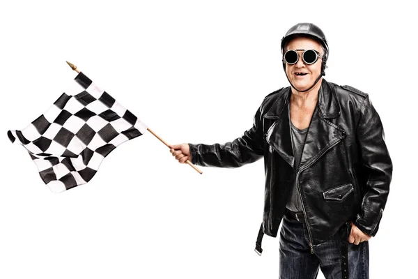 Senior biker waving race flag — Stok fotoğraf