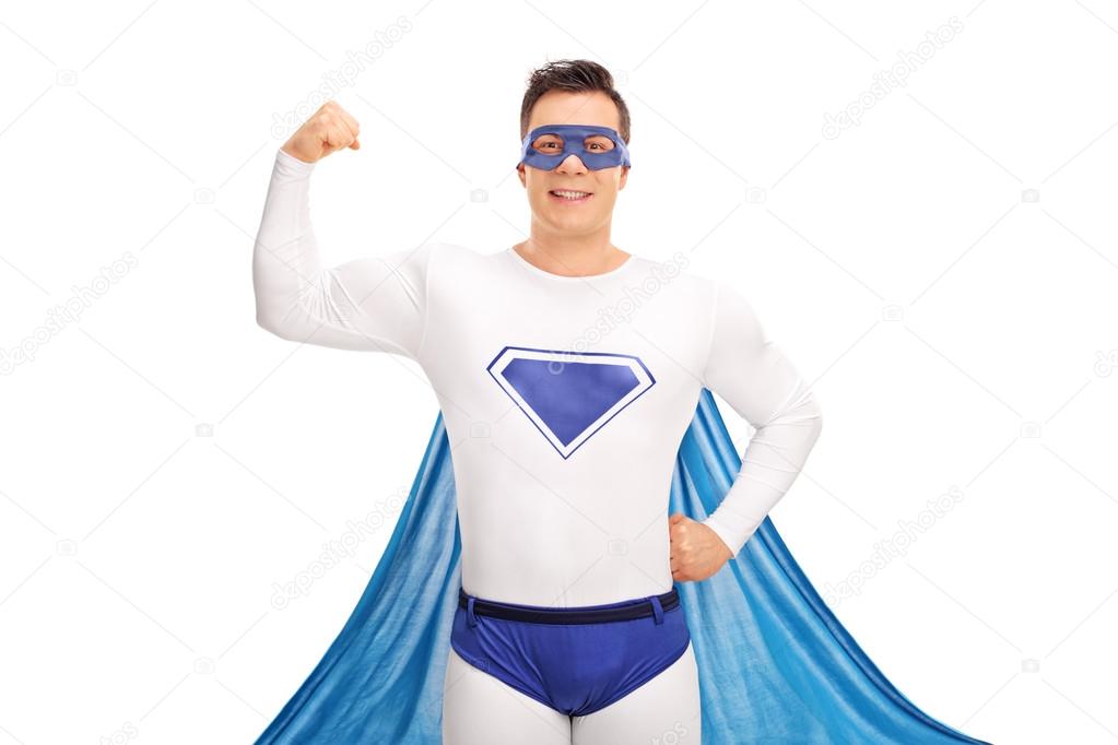 Young superhero flexing his biceps 