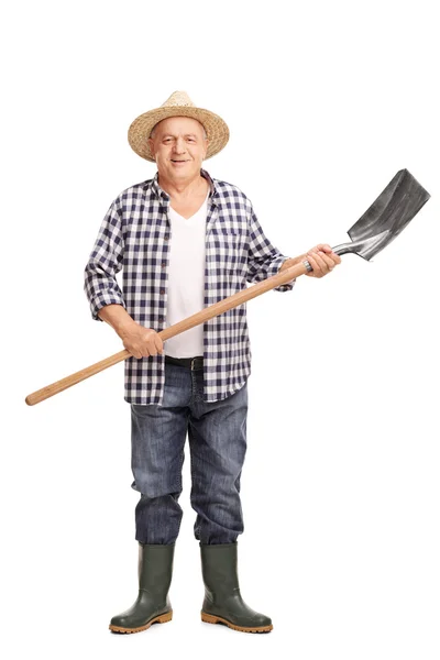 Trabajador agrícola maduro sosteniendo una pala — Foto de Stock