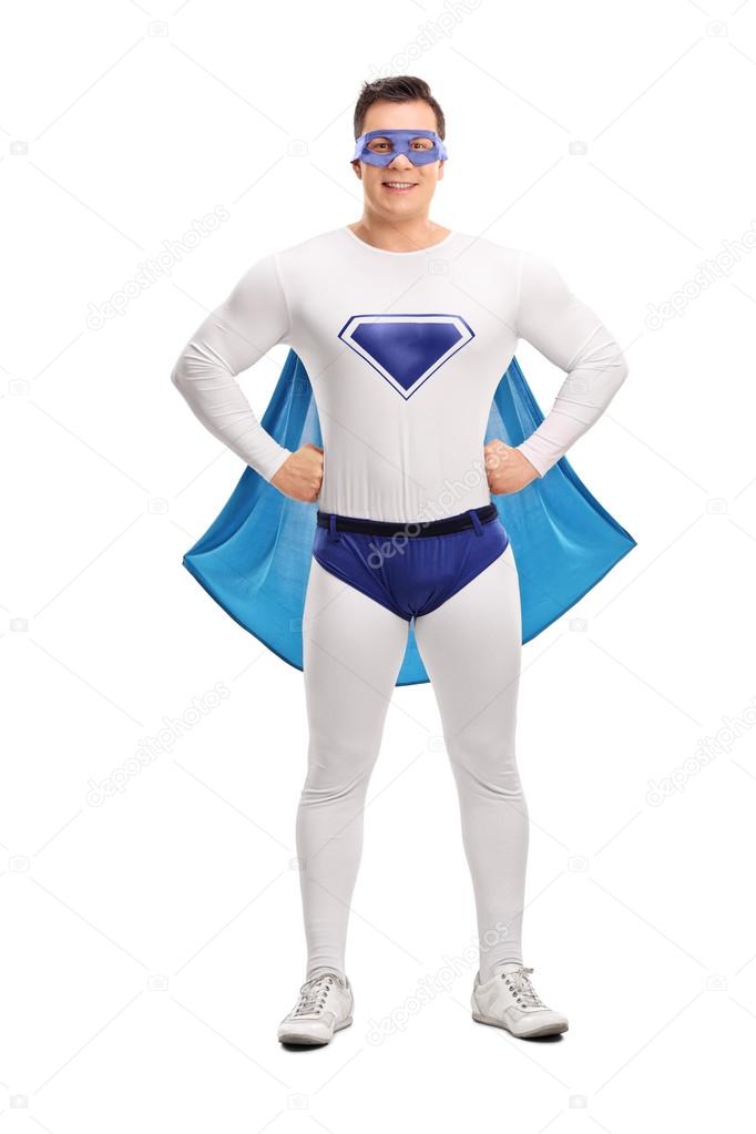 Young proud superhero with a blue cape 