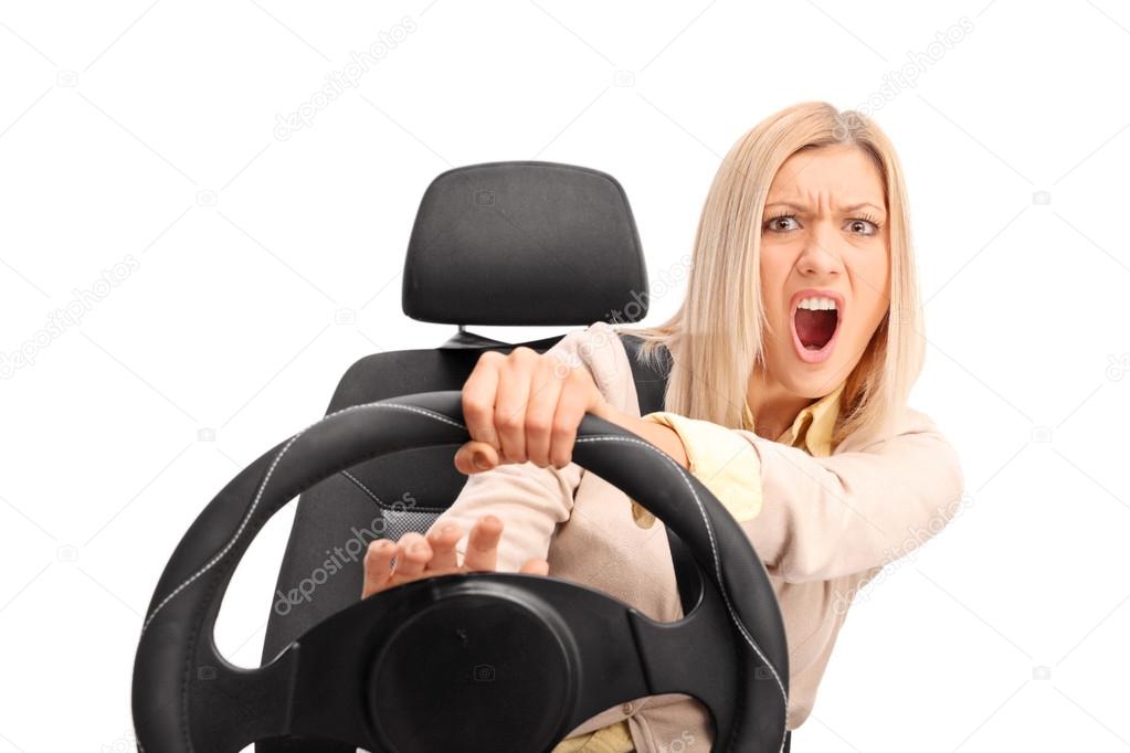 Angry female driver honking on the horn 