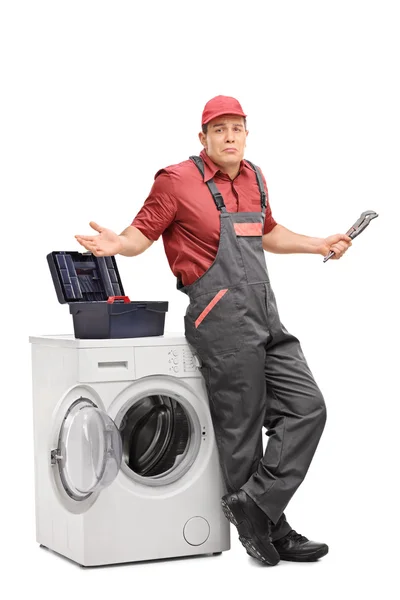 Uncertain plumber gesturing with hands — Stock Photo, Image