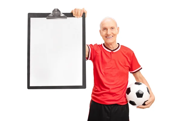 Senior soccer coach holding a clipboard — Zdjęcie stockowe