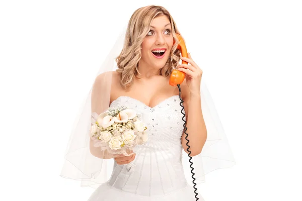 Cheerful bride talking on telephone — Stok fotoğraf