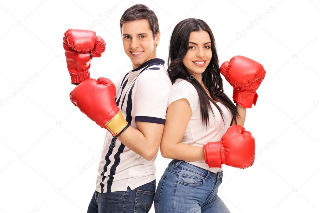 Young man and woman with boxing gloves 