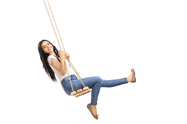 Young carefree girl swinging on a swing — Stock Photo, Image