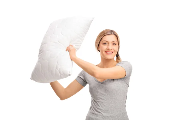 Woman having a pillow fight Stock Photo