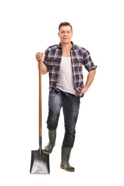 Male manual worker holding a shovel 