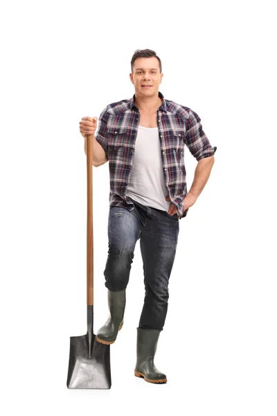 Male manual worker holding a shovel — Stockfoto