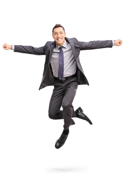 Businessman jumping out of happiness — Stock Photo, Image