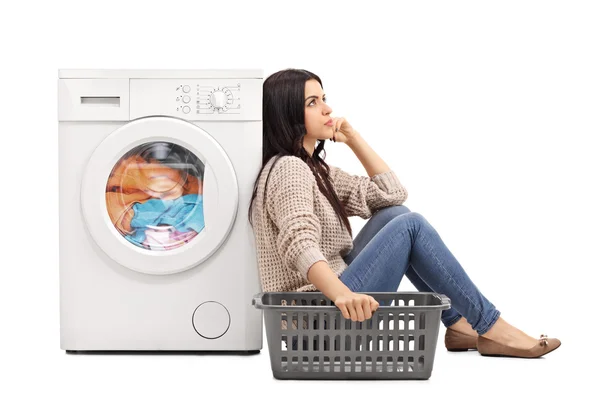 Bored woman waiting for the laundry — Stock Photo, Image