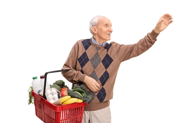 Uomo anziano shopping e raggiungere qualcosa — Foto Stock