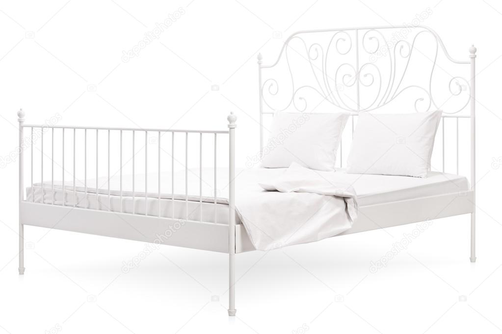 White bed with a vintage decoration 