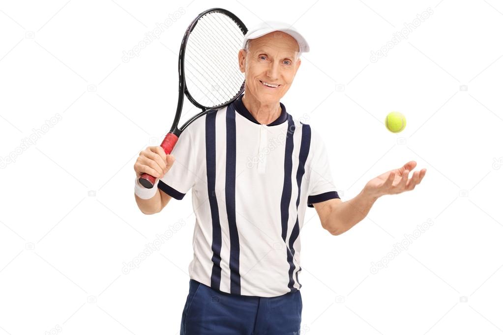 Senior tennis player holding a racket