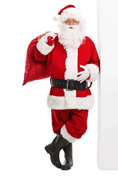 Santa Claus holding a red bag — Stock Photo, Image